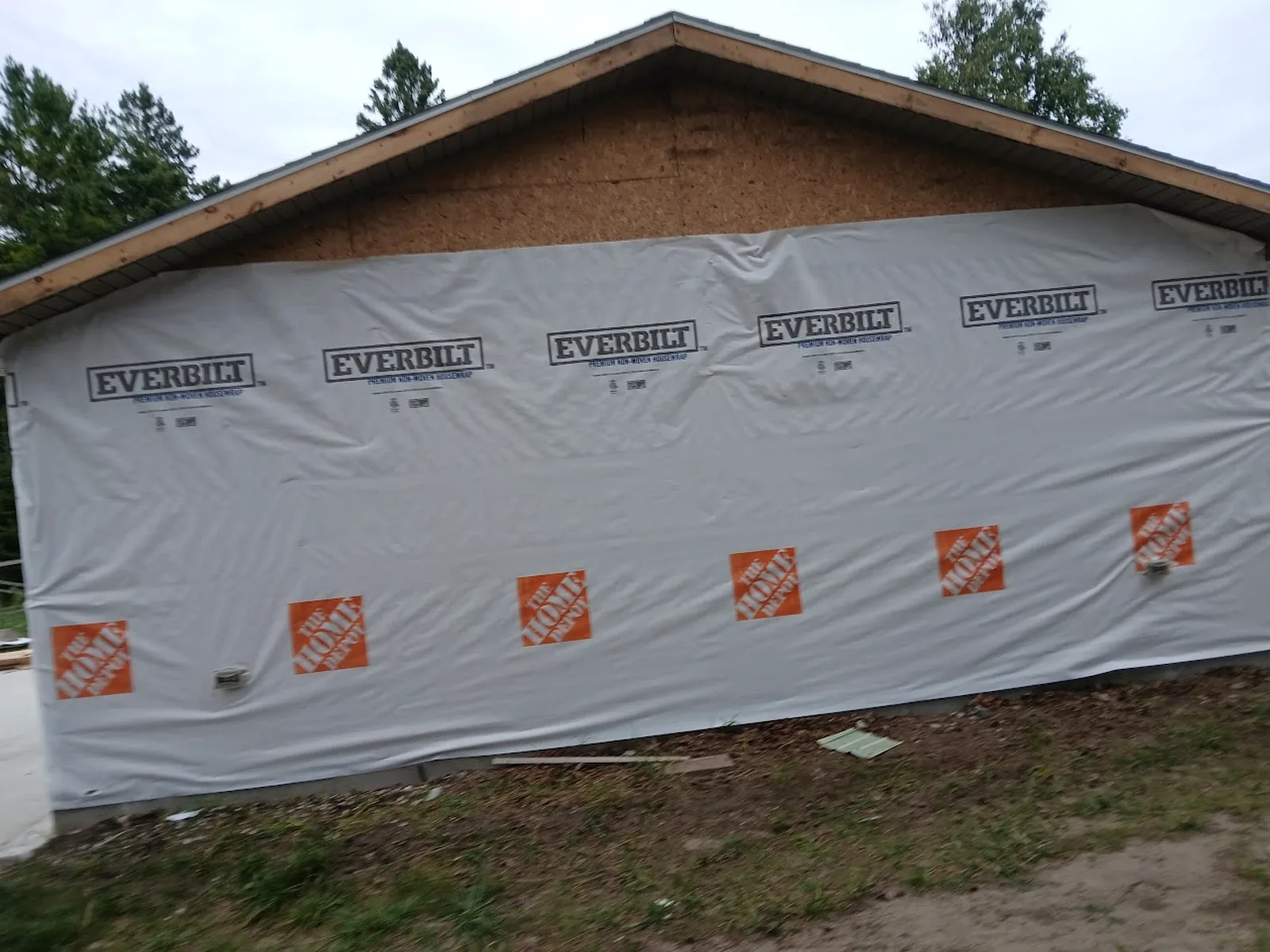 House wrap and exterior preparation before siding finish